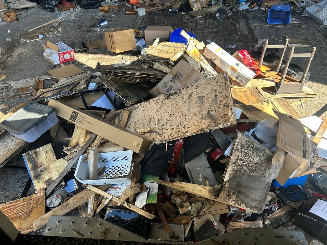 A large pile of broken wood and renovation debris